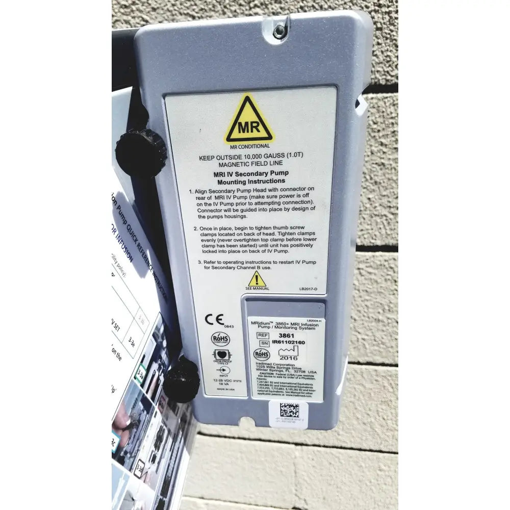 Gray plastic Masimo Mridium 3600 plus MRI infusion pump with black clamps and model number 3861 label for pump monitoring systems