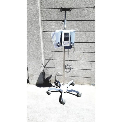 White masimo mridium 3600 plus mri infusion pump on a wheeled stand for infusion pump monitoring and pump monitoring systems