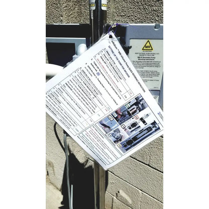 White paper instruction sheet with black text and diagrams on gray masimo mridium 3600 plus mri infusion pump monitoring system enclosure
