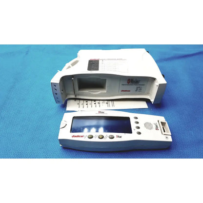 White plastic medtronic radical 7 pulse oximeter spo2 and base unit with digital display for clinical hospital use