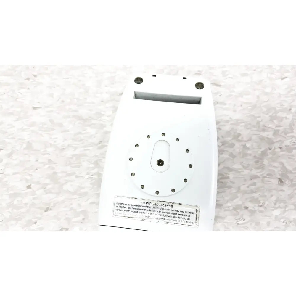 White plastic back of masimo radical-7 signal pulse oximetry device with circular holes and rectangular slot for oximetry touch color