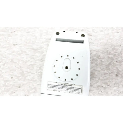 White plastic back of masimo radical-7 signal pulse oximetry device with circular holes and rectangular slot for oximetry touch color