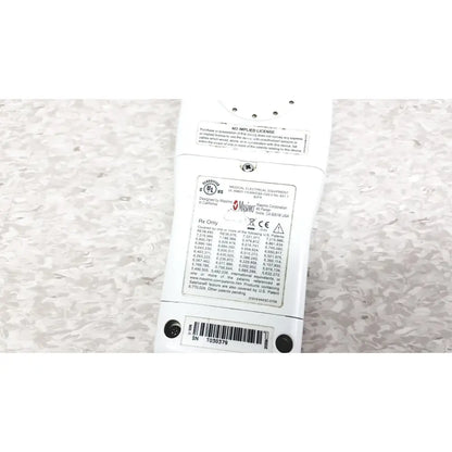 White plastic power strip with multiple outlets and certification label at the back of masimo radical-7 signal pulse oximetry touch color patient monitor