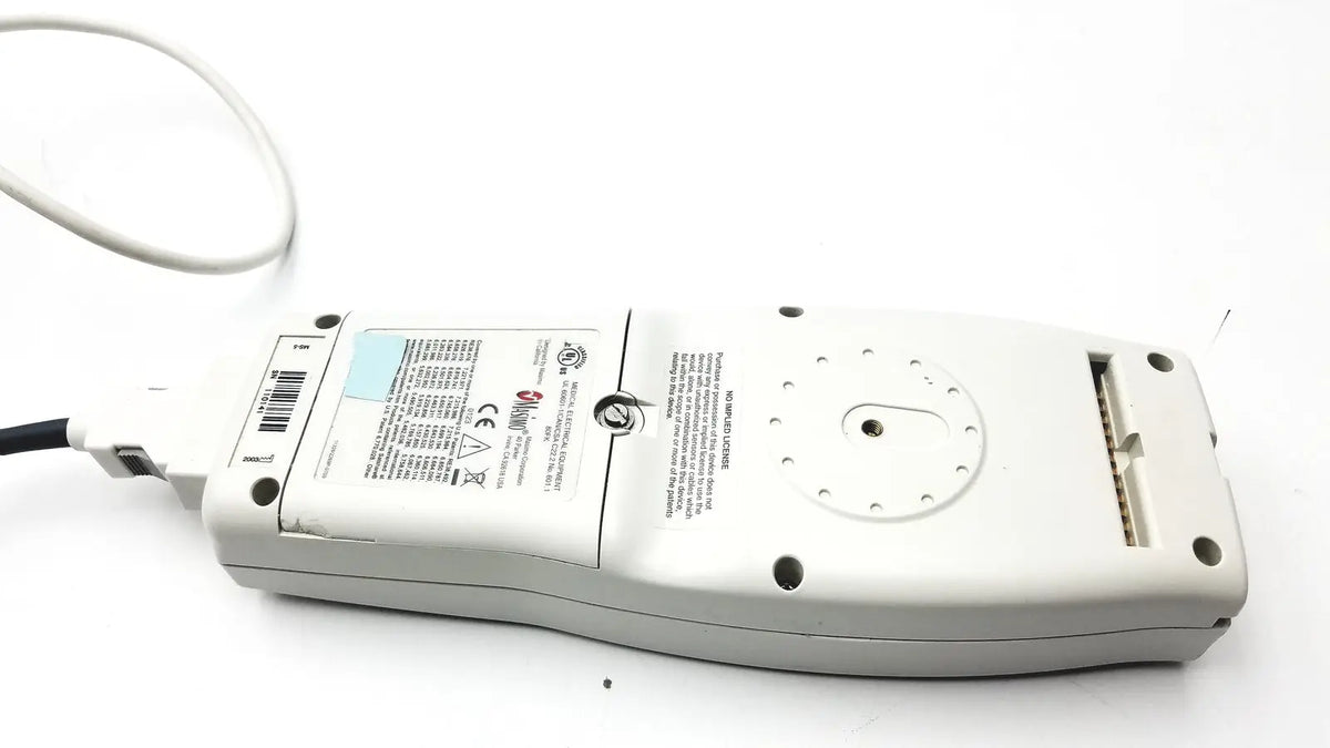 White plastic masimo set radical pulse oximeter back panel with coiled cable and labeled radical signal extraction specs