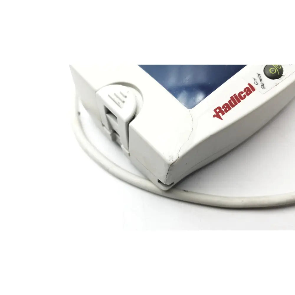 White masimo set radical signal extraction pulse oximeter on standby with blue screen and red branding untested model