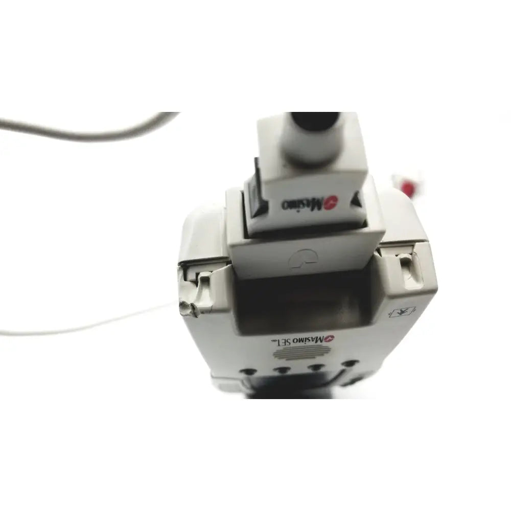 White plastic masimo set radical pulse oximeter monitor with black sensor head and red masimo logo for signal extraction
