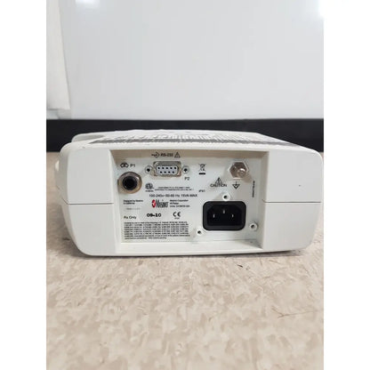 White plastic back panel of masimo set rainbow rad 87 medical monitor with multiple ports including rs 232 and power input socket