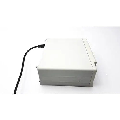 A beige plastic cash register with a black power cord for masimo surgical extraction pulse oximeter use