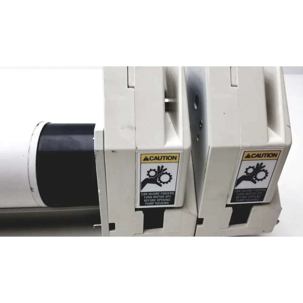 Masterflex i P digital modular drive with white industrial pump housing and black motor featuring caution labels