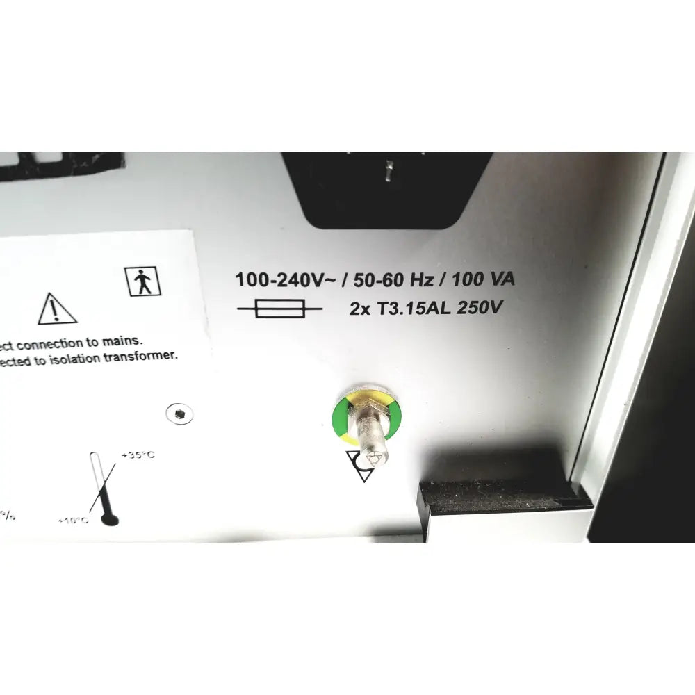 White electrical panel with black printed specifications and green circular power switch on mauna kea technologies f400-v2 cellvizio console back side