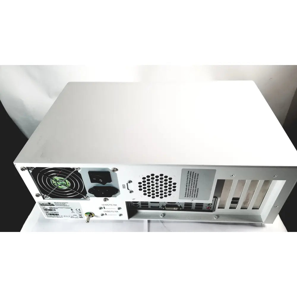 Back side of white metal mcd medical computers processor 9900167m with black fan power ports and ventilation grilles