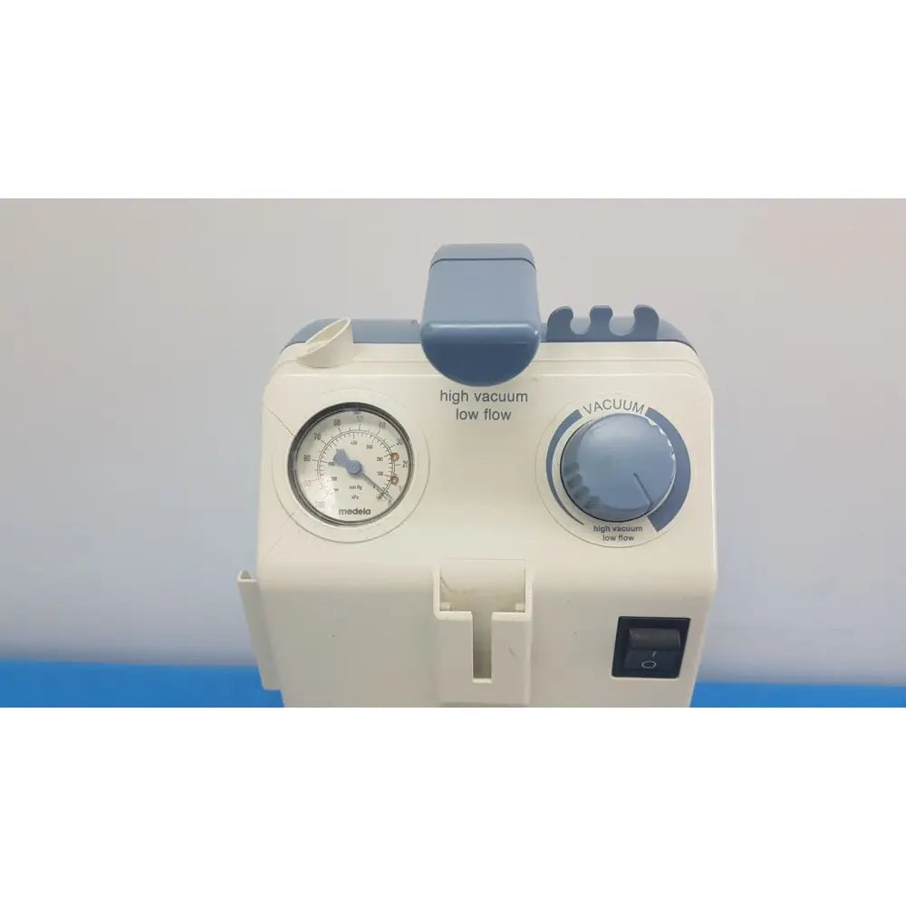 White and blue Medela Vario 18 suction pump aspirator with pressure gauge vacuum dial and control switch portable unit