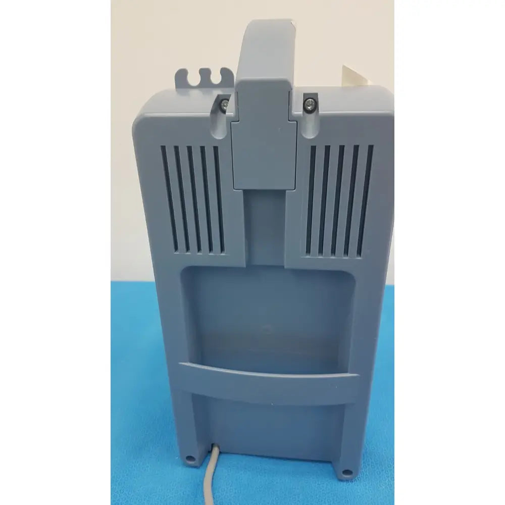 Gray plastic medela vario 18 suction pump aspirator with vertical vents and top handle portable medical vacuum unit