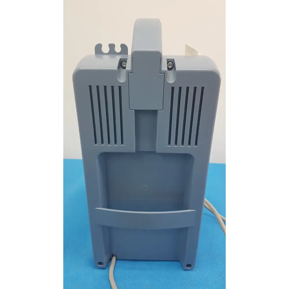 Gray plastic Medela Vario suction pump aspirator with vertical vents and top handle for portable medical vacuum use