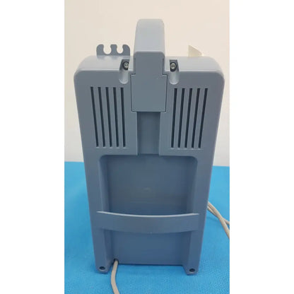 Gray plastic Medela Vario suction pump aspirator with vertical vents and top handle for portable medical vacuum use