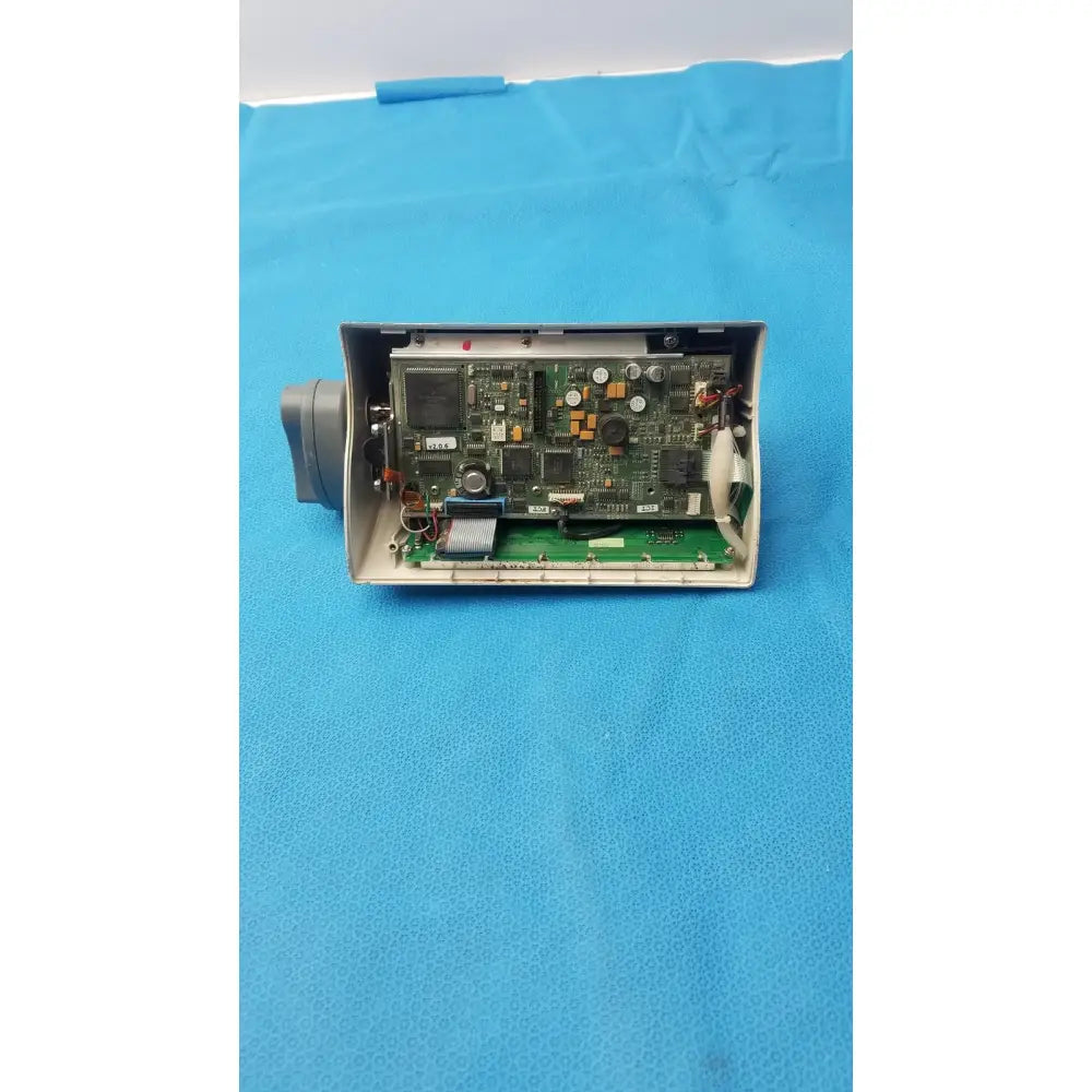 Medfusion 3500 gray plastic housing with exposed green circuit board and rotating pole clamp for secure mounting
