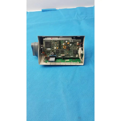 Medfusion 3500 gray plastic housing with exposed green circuit board and rotating pole clamp for secure mounting