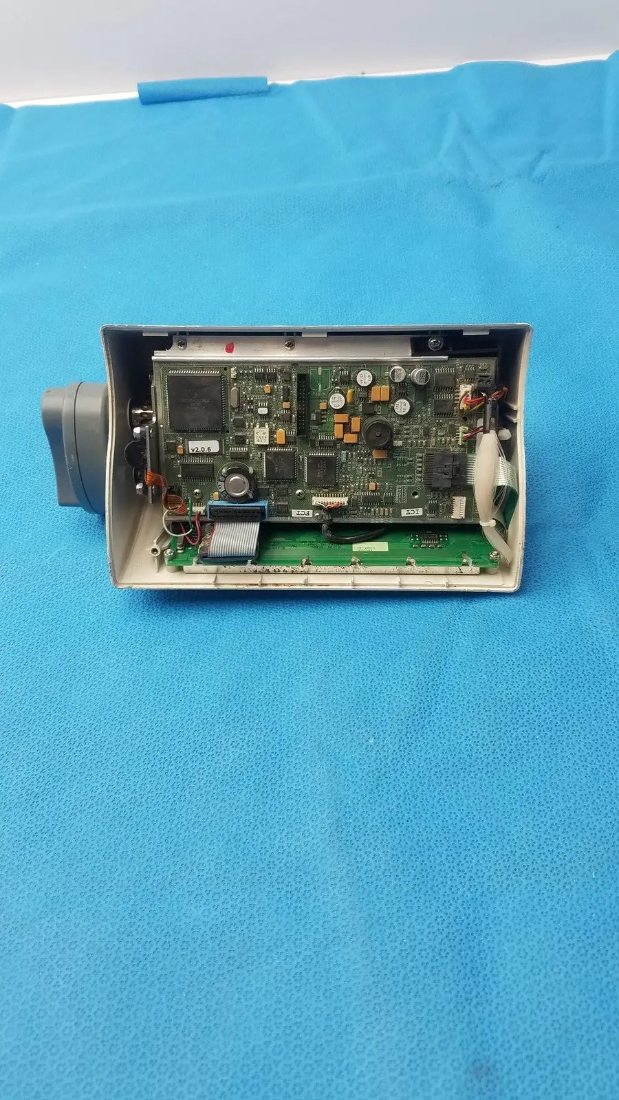 Medfusion 3500 gray plastic housing with exposed green circuit board and rotating pole clamp for secure mounting