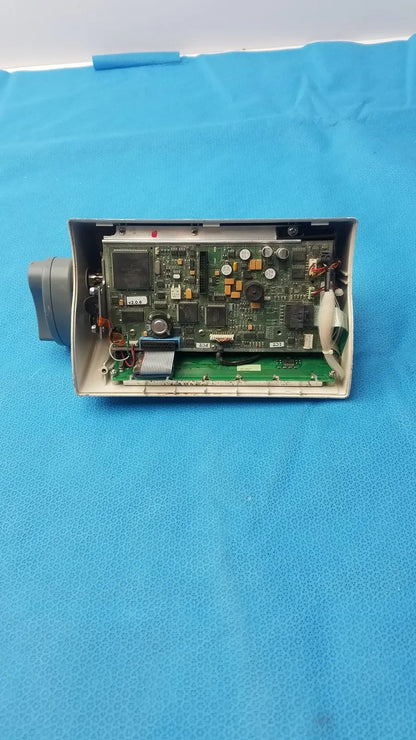 Medfusion 3500 gray plastic housing with exposed green circuit board and rotating pole clamp for secure mounting