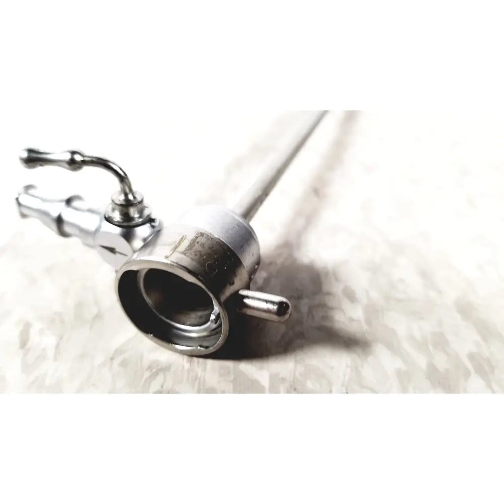 Silver-colored metal medical horizon endoscope with cylindrical body and articulated control handles for single valve use