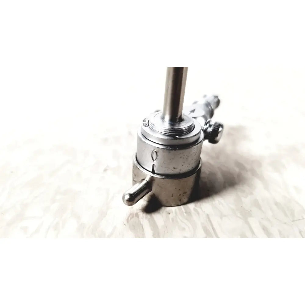 Silver-colored metal gas regulator with threaded connections and knobs for medical horizon endoscope single valve sheath