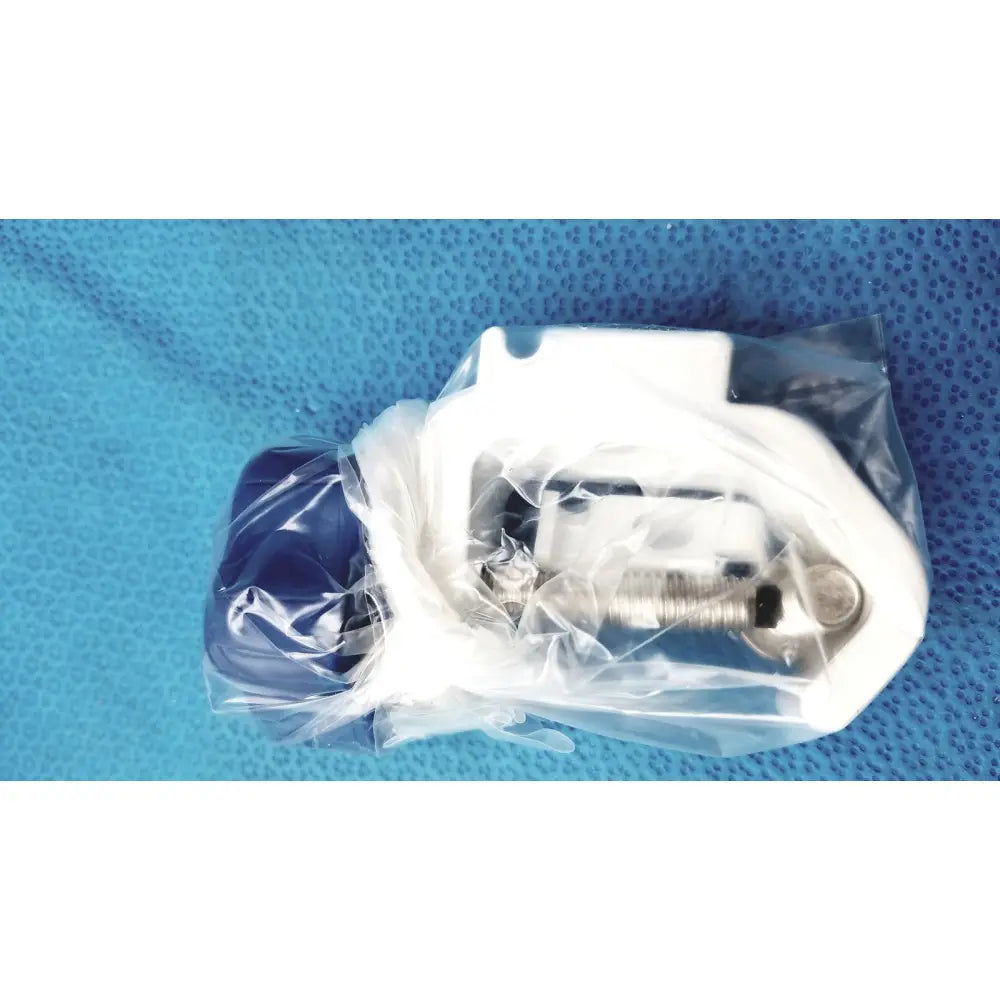 White and blue surgical clamp wrapped in clear plastic for medical power supply of covidien kangaroo feeding pump