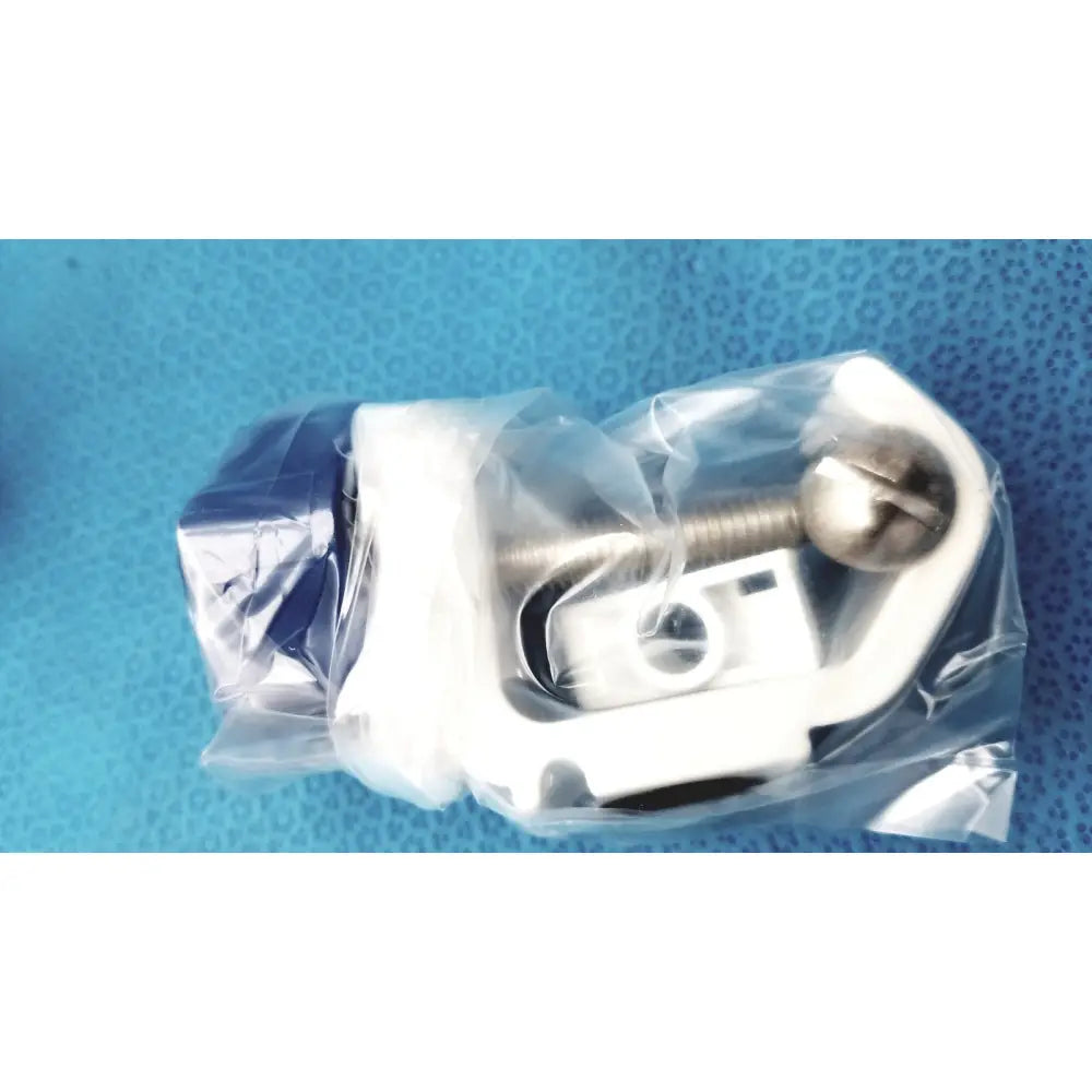 White plastic and metal clamp with silver screw head for medical power supply of covidien kangaroo feeding pump