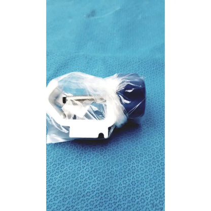 White and navy blue plastic mounting bracket with screws wrapped in clear plastic for medical power supply covidien kangaroo feeding pump