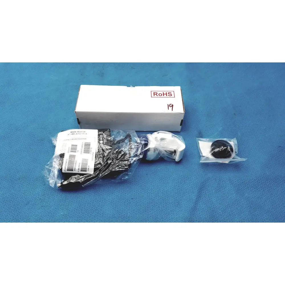 White plastic medical power supply labeled rohs 19 for covidien kangaroo feeding kangaroo feeding pump