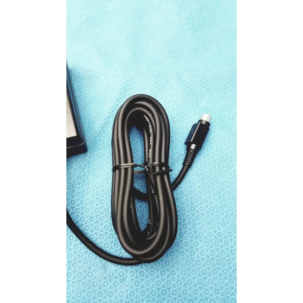 Black coiled medical power supply cable with silver and black connector for Covidien Kangaroo feeding pump