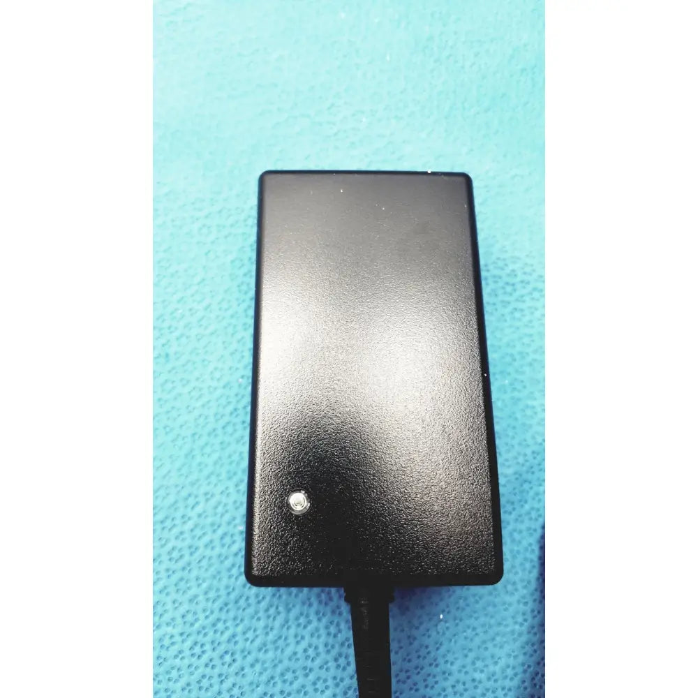 Black rectangular medical power supply with matte finish and indicator light for covidien kangaroo feeding pump