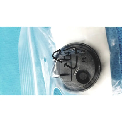 Black circular push button with pe-10 markings in a clear bag for medical power supply of covidien kangaroo feeding pump