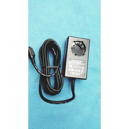 Black rectangular medical power supply with coiled cable and usb-c connector for covidien kangaroo feeding pump