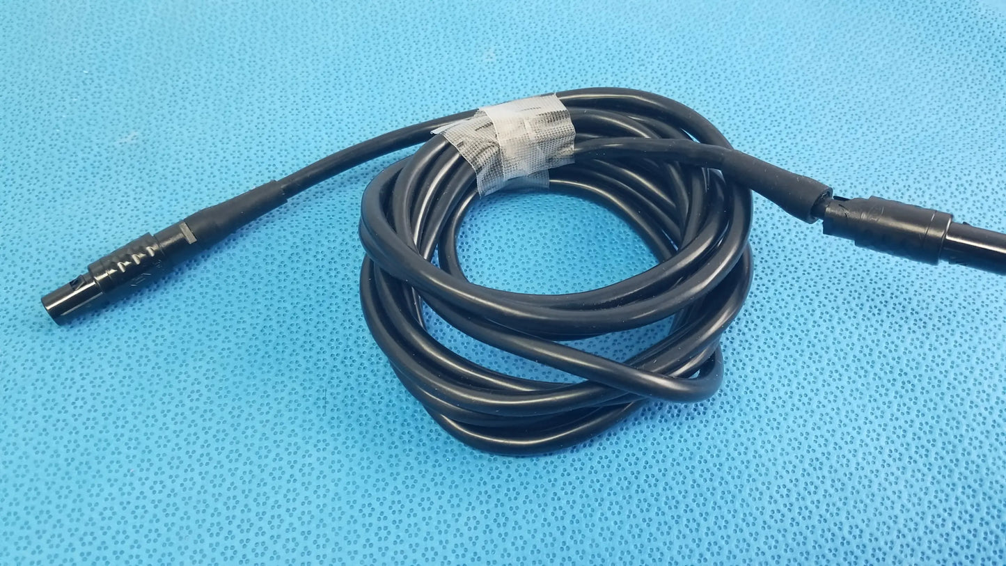 Black coiled medical surgical handpiece console extension cable with threaded metallic and smooth plastic connectors