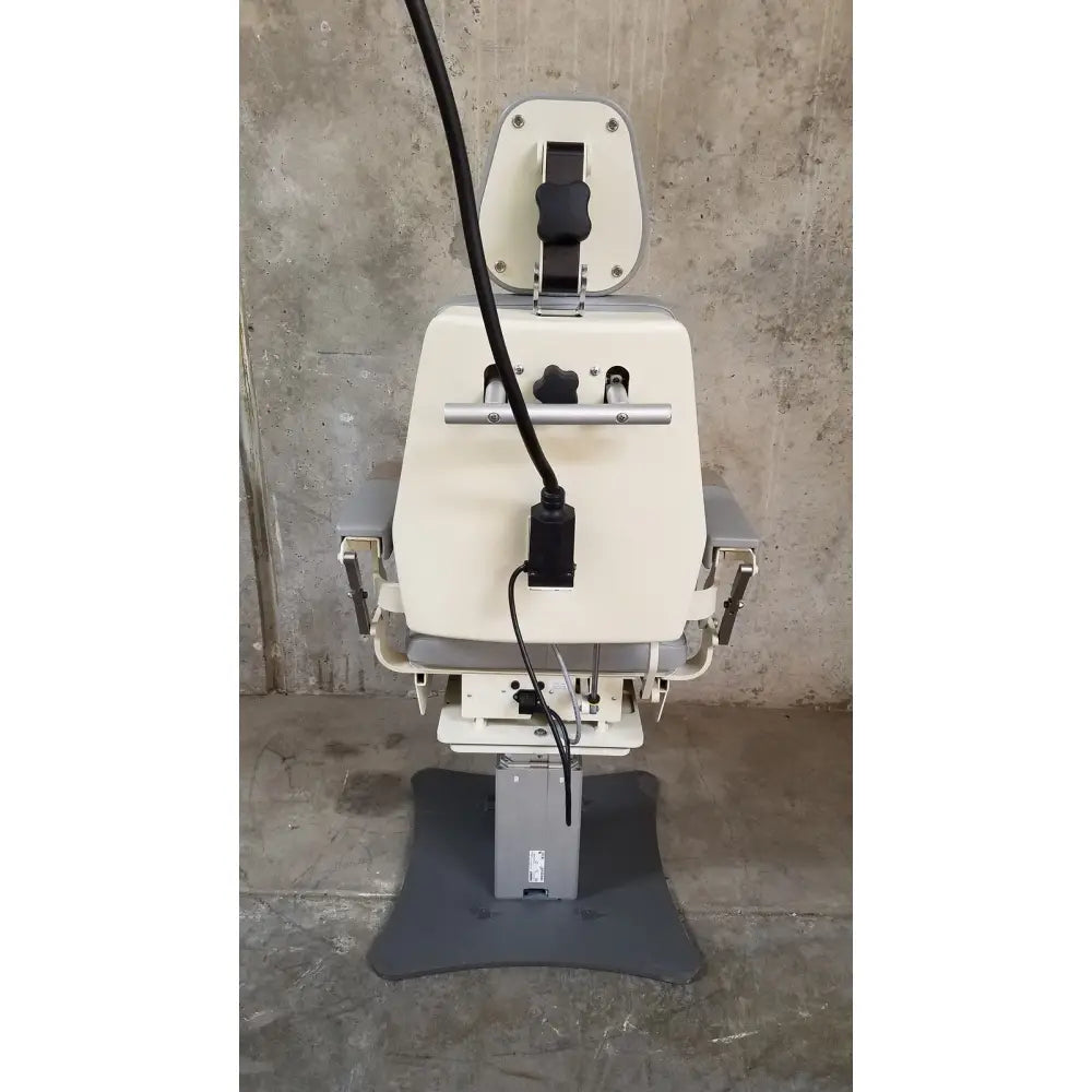 Medical Technology Industries Power Lift Exam Chair with cream padded seat, gray metal frame, adjustable height, and power cord