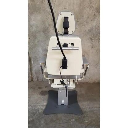 Medical Technology Industries Power Lift Exam Chair with cream padded seat, gray metal frame, adjustable height, and power cord