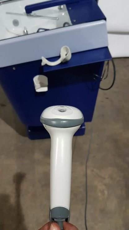 White and gray handheld barcode scanner with ergonomic grip used in medivators advantage plus endoscope reprocessor system