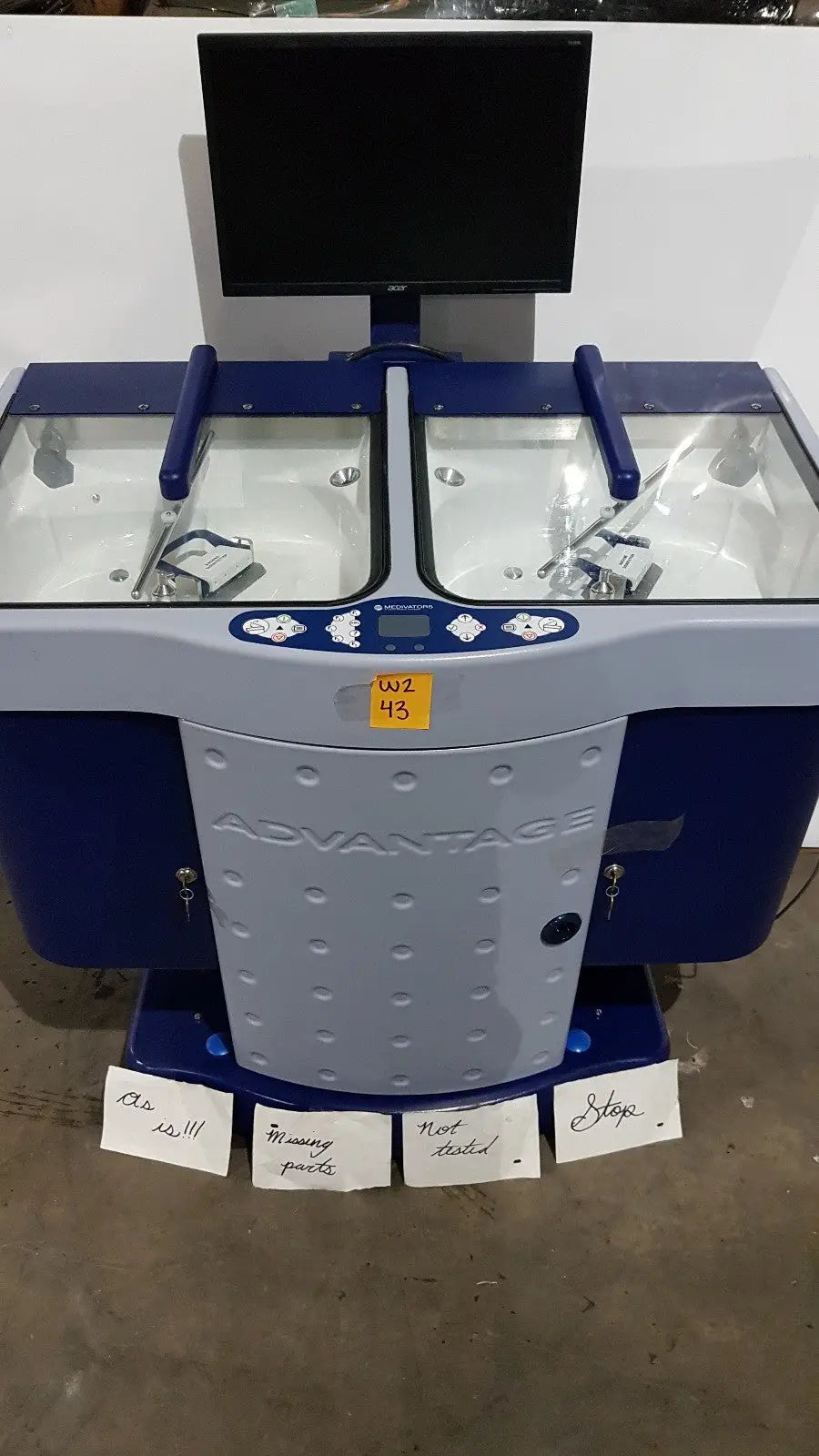 Blue and gray Medivators Advantage Plus endoscope reprocessor with two transparent workstations for efficient cleaning