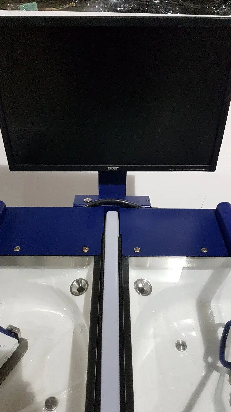 Black acer monitor mounted on blue metal stand with white and black trays on medivators advantage plus endoscope system