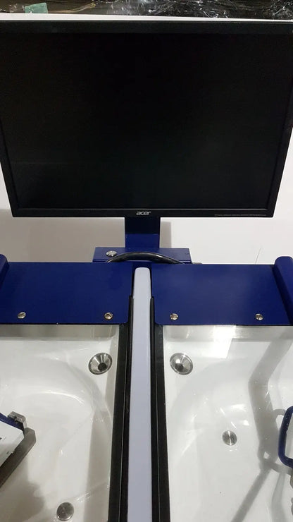 Black acer monitor mounted on blue metal stand with white and black trays on medivators advantage plus endoscope system