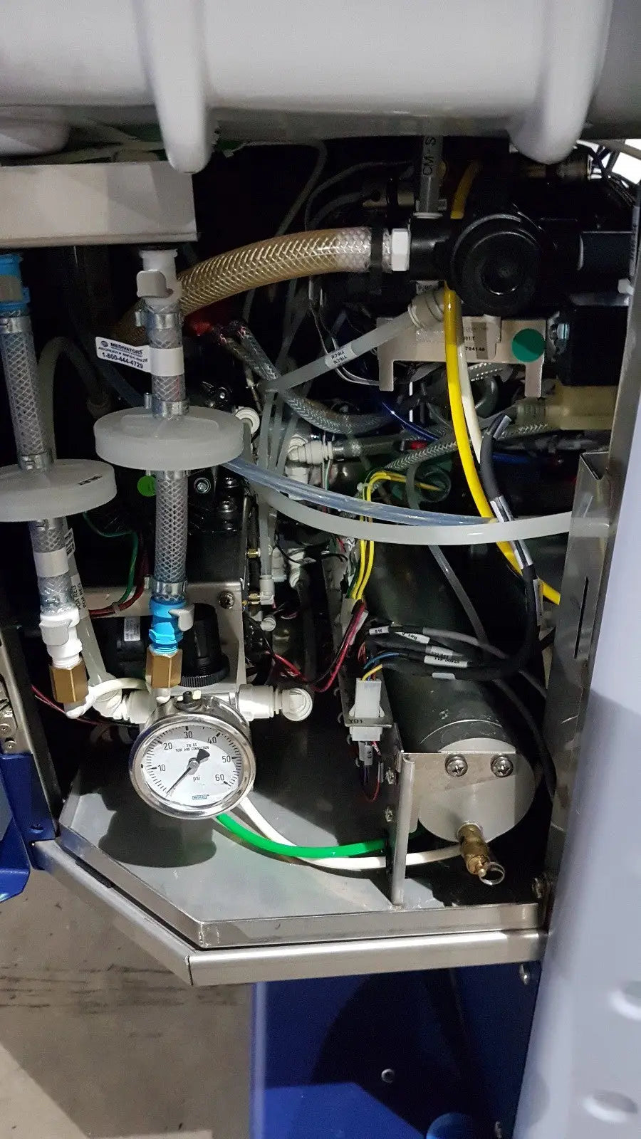 Industrial-grade pressure gauge with metallic casing and white dial on medivators advantage plus endoscope reprocessor system