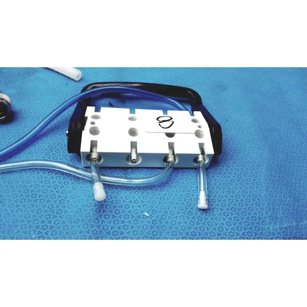 White and black Medivators hook-up connector assembly 434744 with transparent tubing for medical fluid management