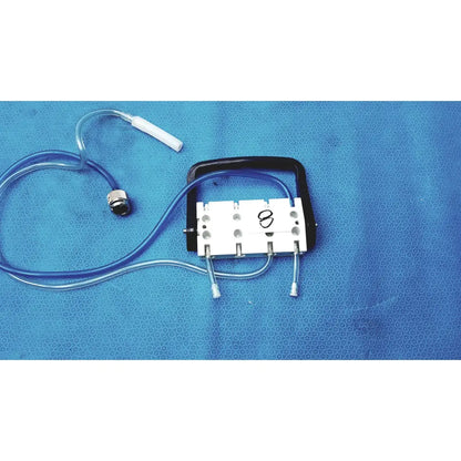 White and black surgical device with blue tubing connected to white cylindrical component medivators hook-up connector assembly 434744
