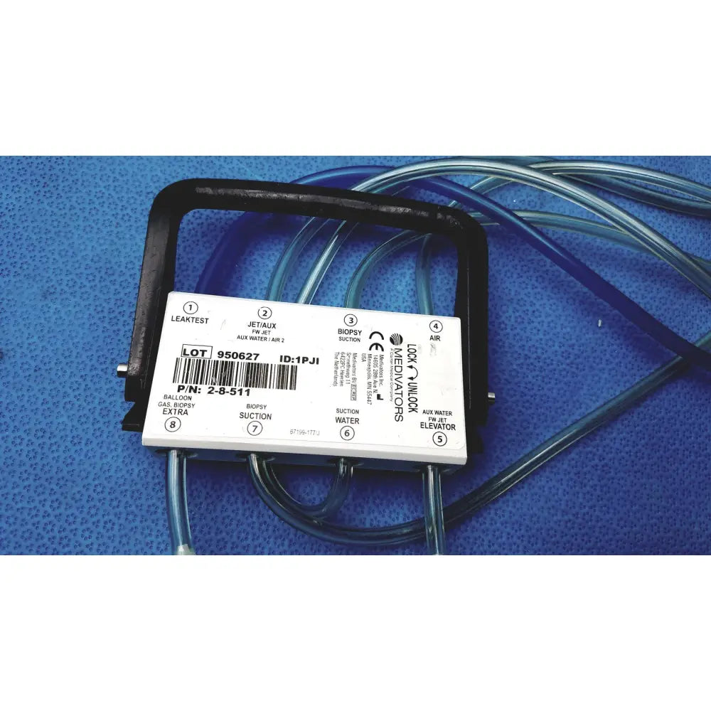 White plastic medivators hook-up connector assembly 950627 with black frame and labeled ports for air suction and balloon gas