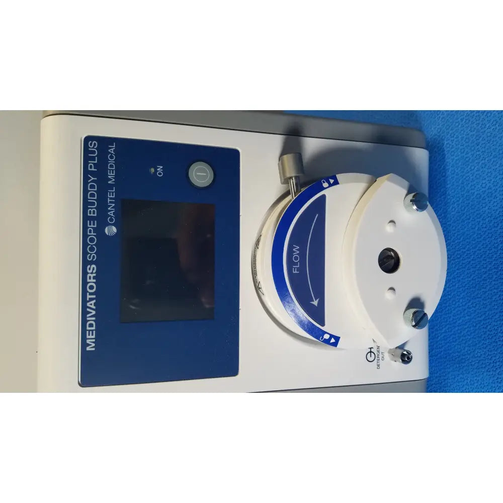 Medivators SBP-100 scope buddy plus medical device in white and blue with digital display, flow control dial, and metallic fittings