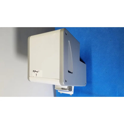 Beige and gray wall-mounted medical device with labeled sticker showing medivators scope buddy plus model sbp-100 back side