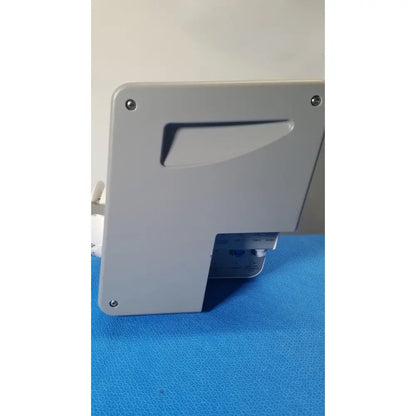 Gray plastic Medivators scope buddy plus device with rectangular cutout, four screws, and blue-labeled bottom section
