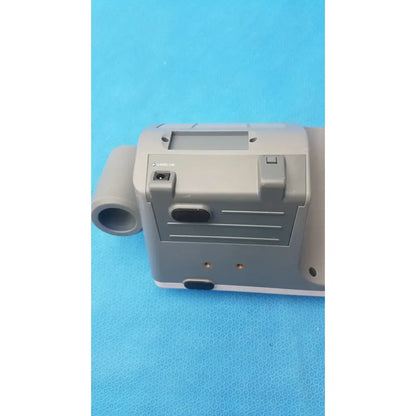 Gray plastic handheld mediwatch md-6000 bladder scanner with small screen buttons and ports for medical use