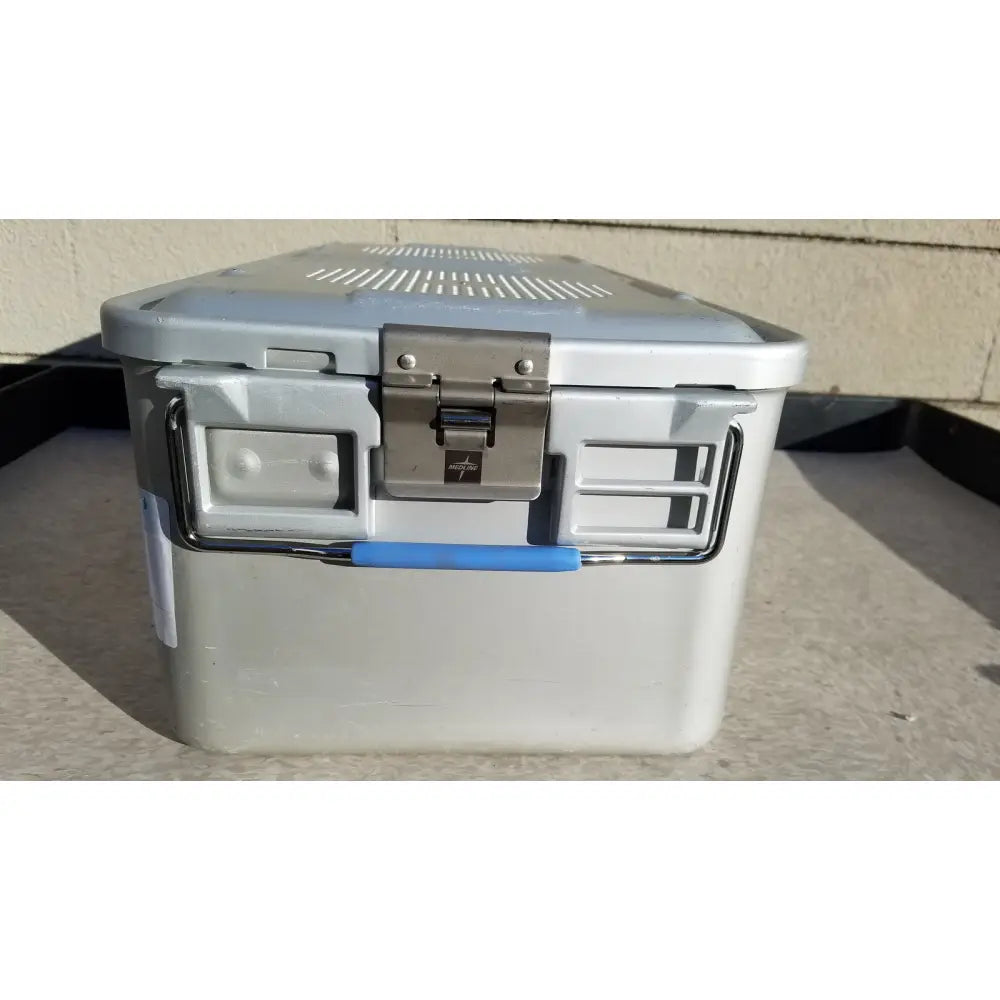 Gray plastic cooler with blue handle and silver metal latch in medline aluminum storage and sterilization container