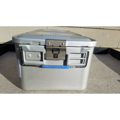 Gray plastic cooler with blue handle and silver metal latch in medline aluminum storage and sterilization container